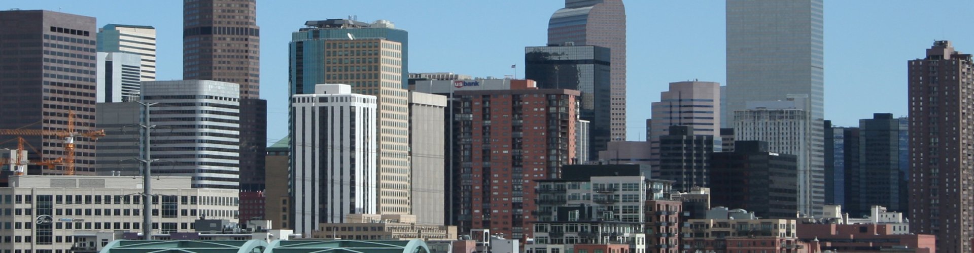 Luxury ride in Denver cityscape at dusk