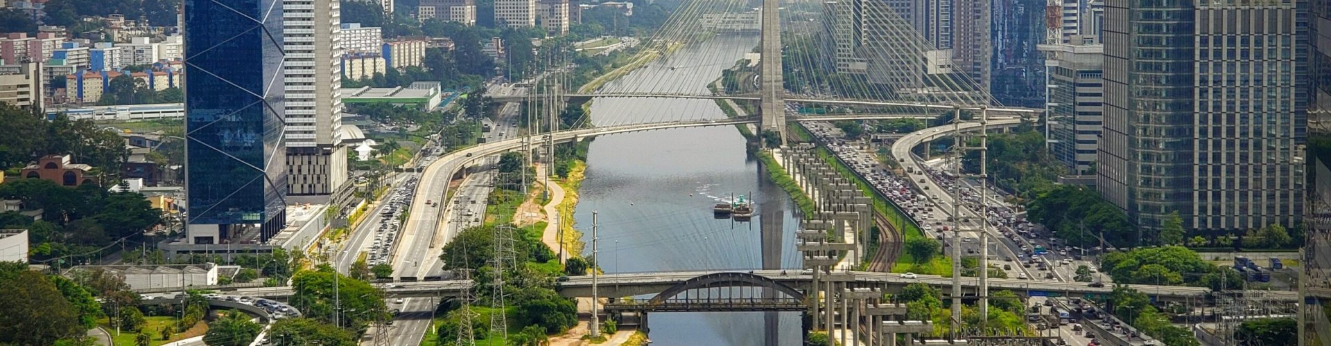 Luxury car parked in front of Sao Paulo skyline