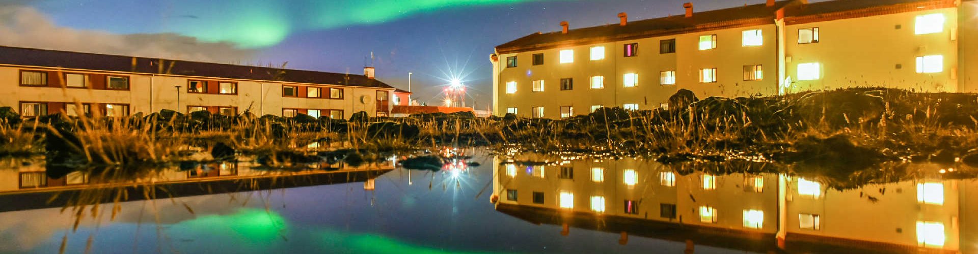 Luxury vehicle parked in scenic Keflavik landscape