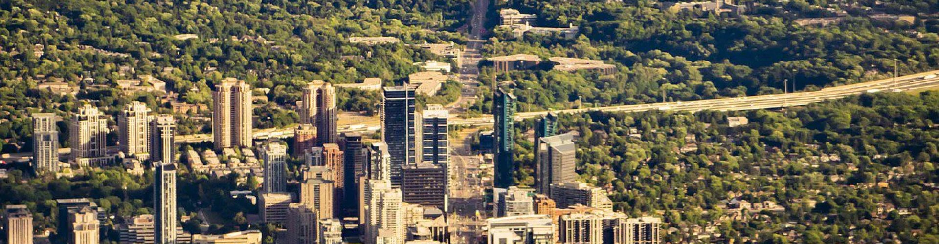 Luxury limousine driving in Toronto at dusk