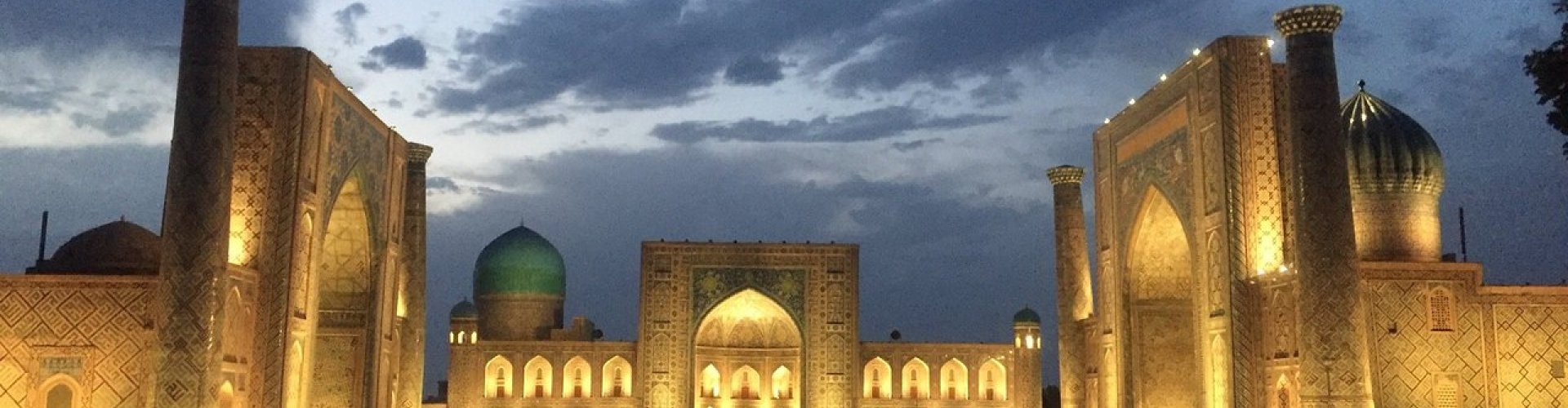 Luxury vehicle parked near Samarkand landmark