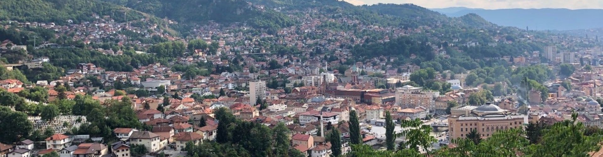 Luxury vehicle parked in Sarajevo cityscape