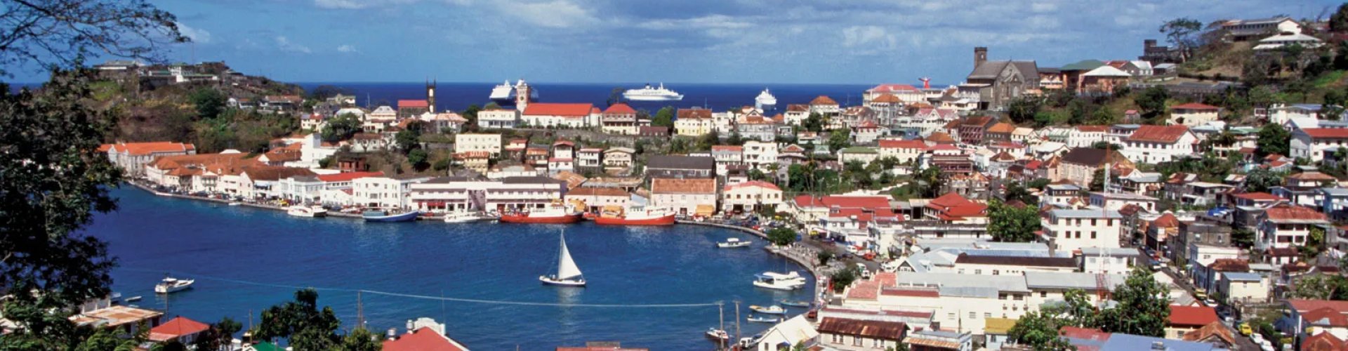 Luxury vehicle overlooking Grenada scenery